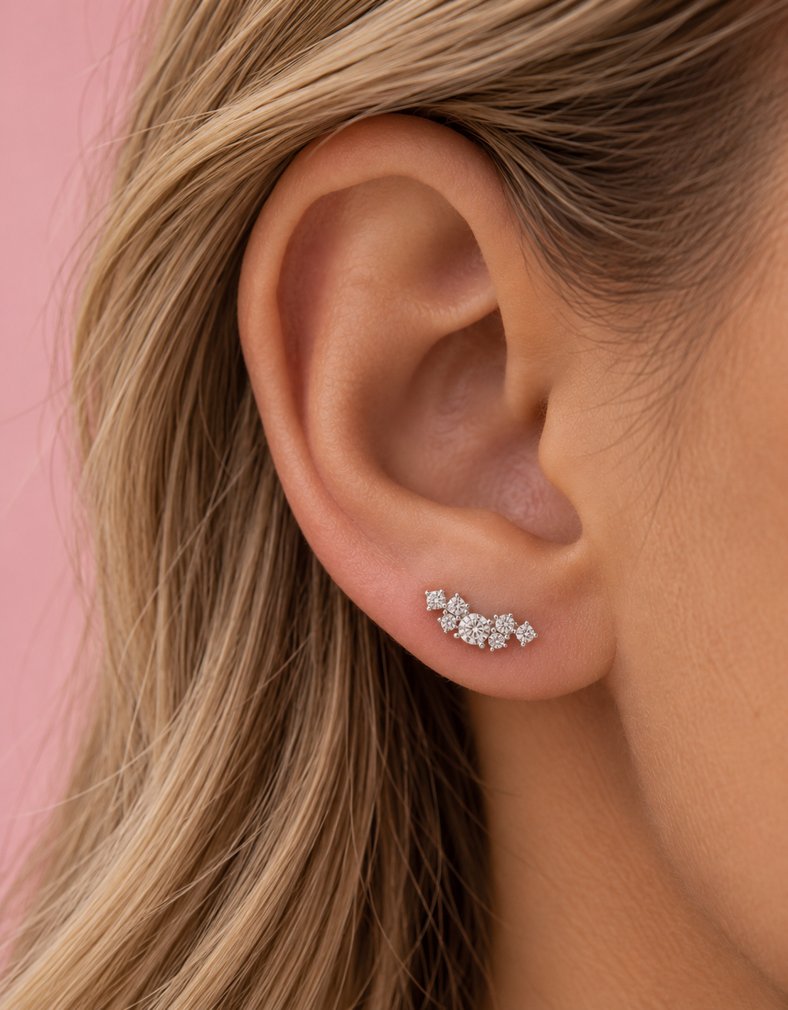 Thea sterling silver CZ climber stud earring showing the petite seven-stone curved design