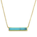 Azure sterling silver with gold vermeil necklace. Featuring a turquoise coloured pendant on a fine gold chain from Joi Jewels. 