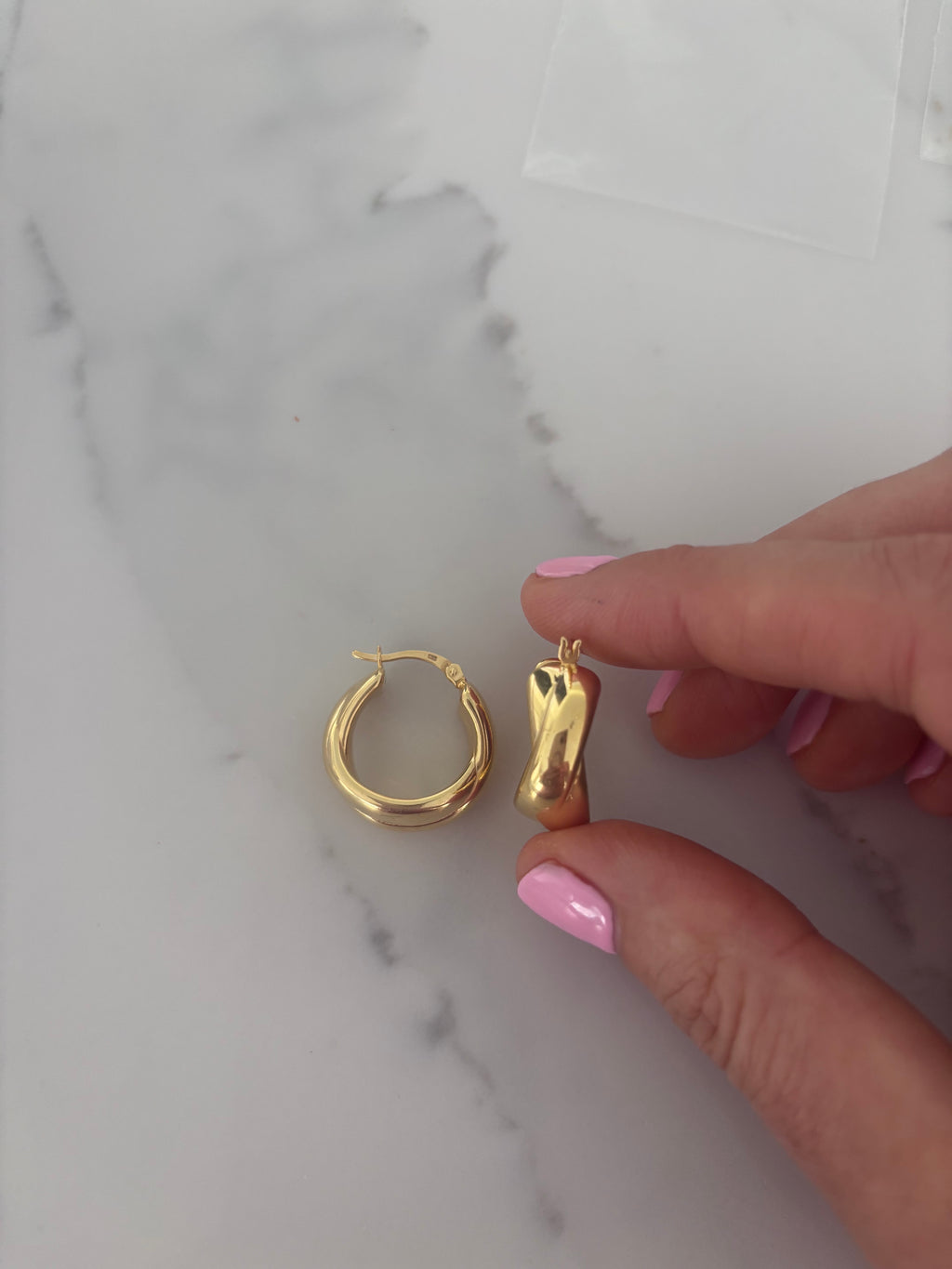 Mercedes gold-coloured chunky crossover hoop earrings by Joi Jewels