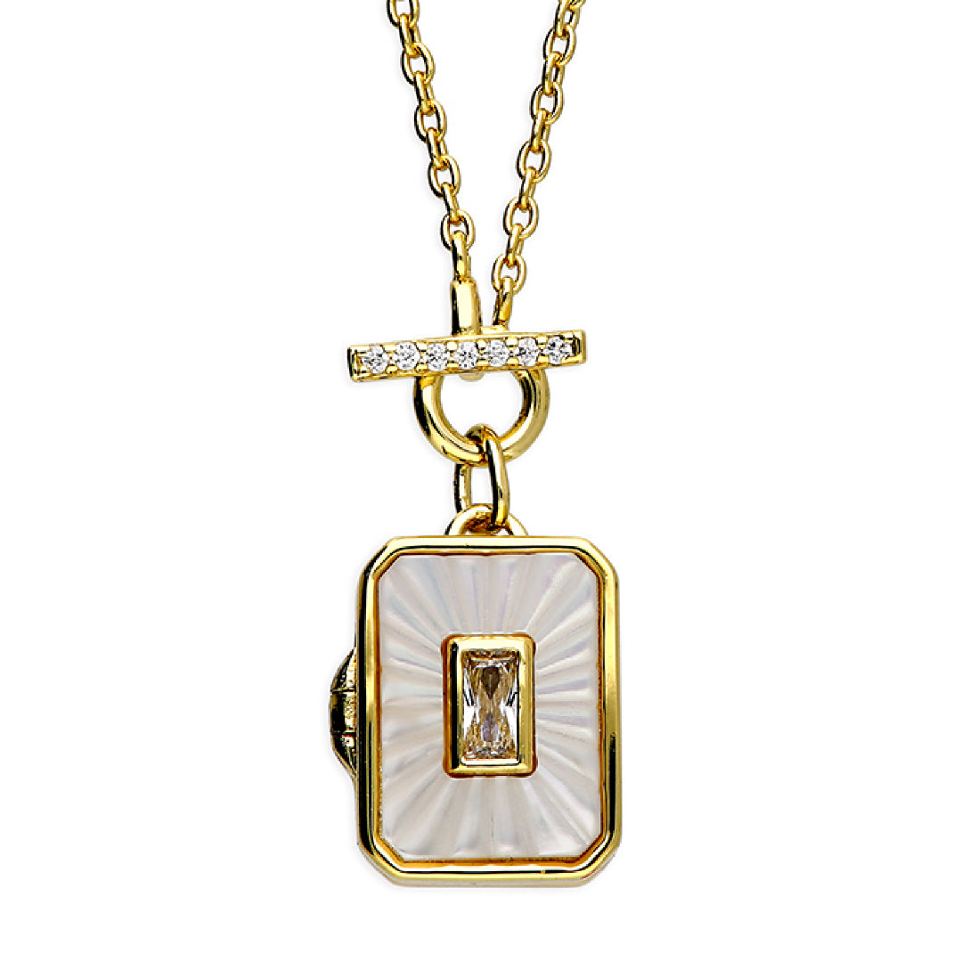 Gold Tbar locket necklace with a rectangular pendant featuring a central gemstone on a white background