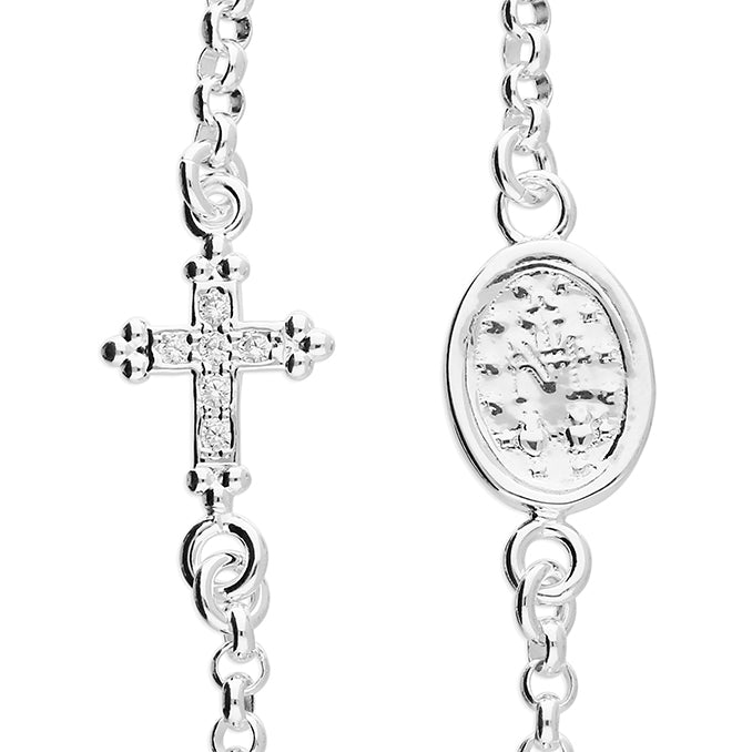 Sterling Silver bracelet with  cross pendant and Miraculous Medal on a white background