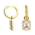 Gold vermeil huggie earring with detachable drop featuring an emerald cut baguette. 