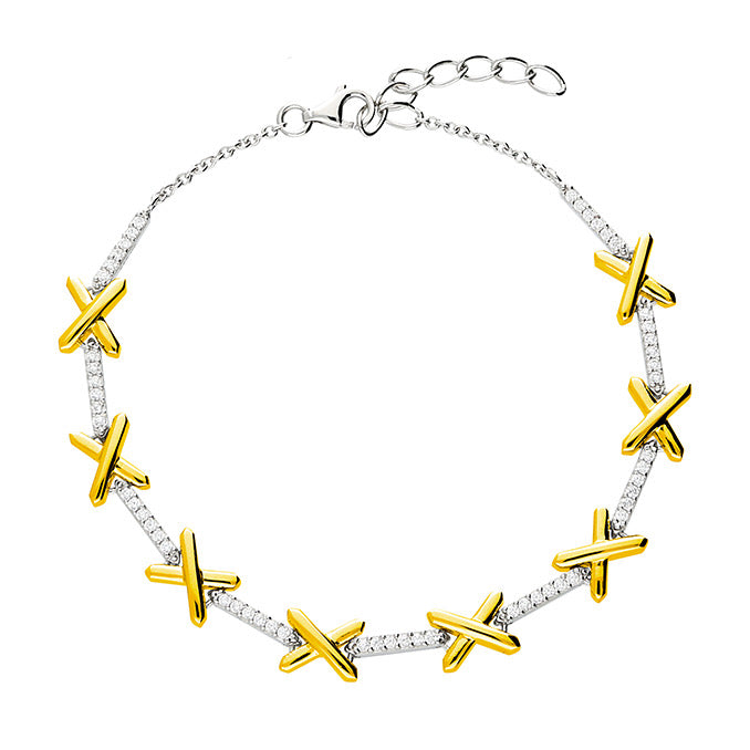 Taylor bracelet in 18 carat gold vermeil and sterling silver featuring polished gold kiss motifs with sprakling cubic zirconia links. 